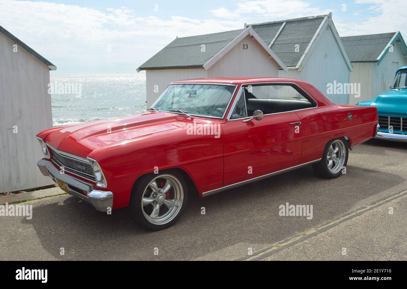 Classic red Chevrolet Chevy II motorcar on Felixstowe seafront. Stock Photo