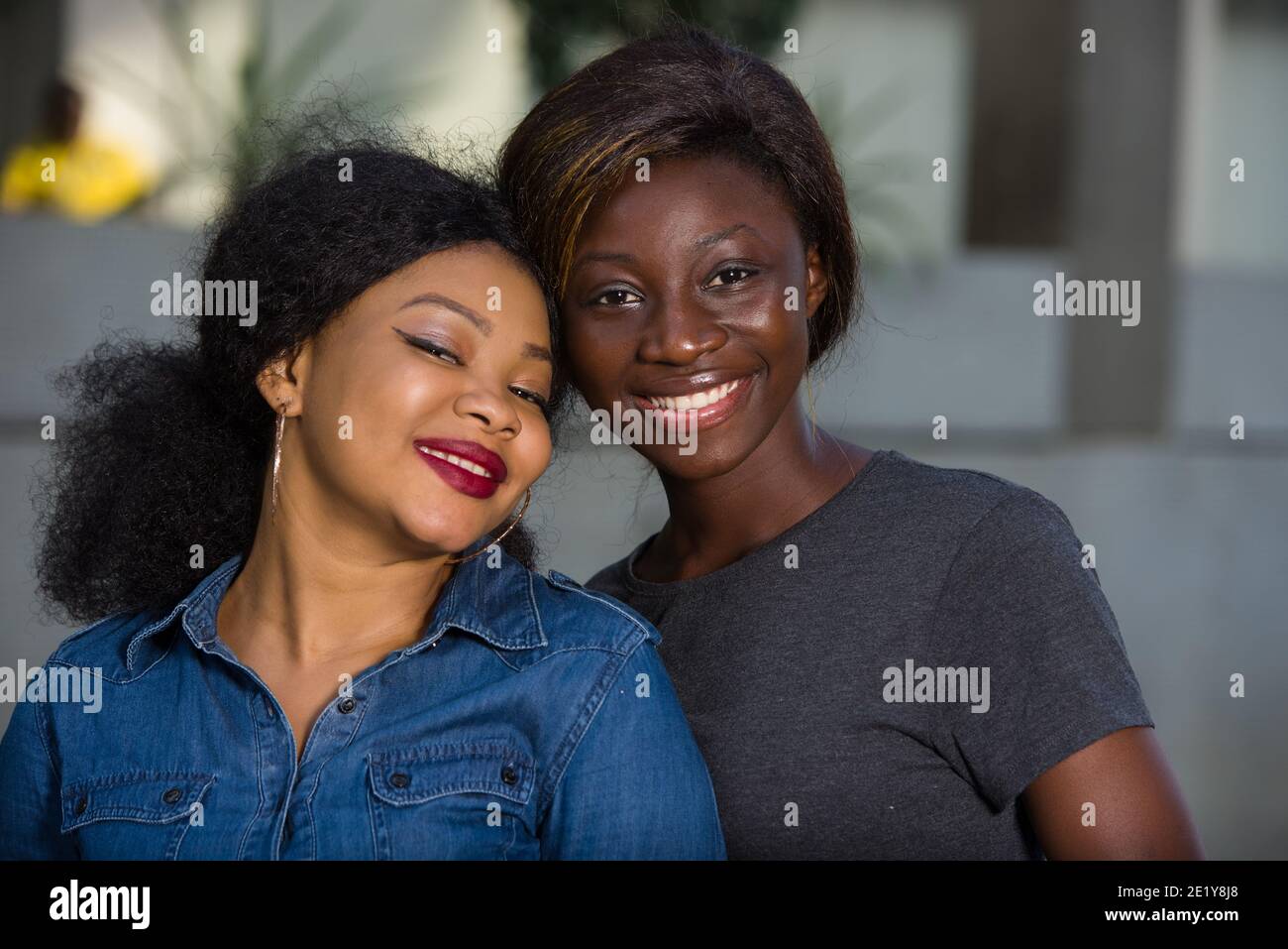 Two women standing together hi-res stock photography and images - Alamy