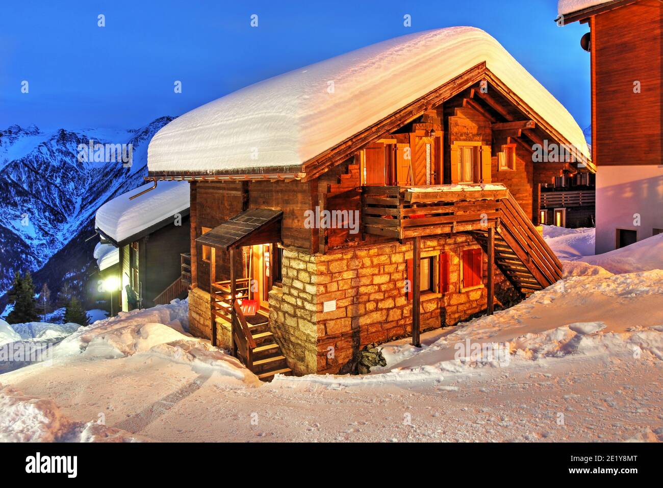 A picturesque chalet in Swiss Alps at night under abundant snow. This particular village is Bettmeralp in the Canton of Valais (Wallis), Switzerland. Stock Photo