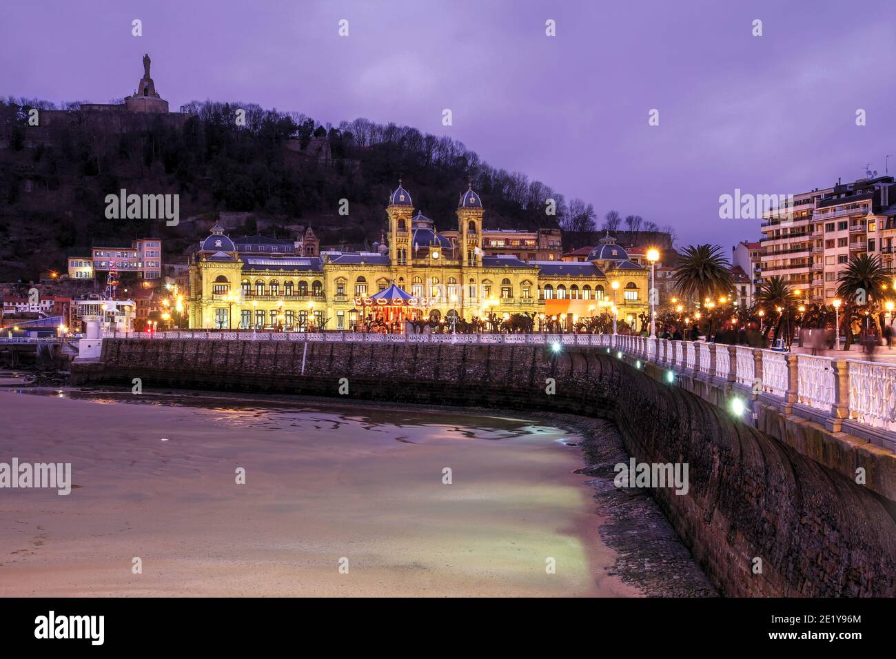 Night scene witht the City Hall of San Sebastian (Donostia in Basque country language) in Spain taken from the city's famous beaches. Taken during a m Stock Photo