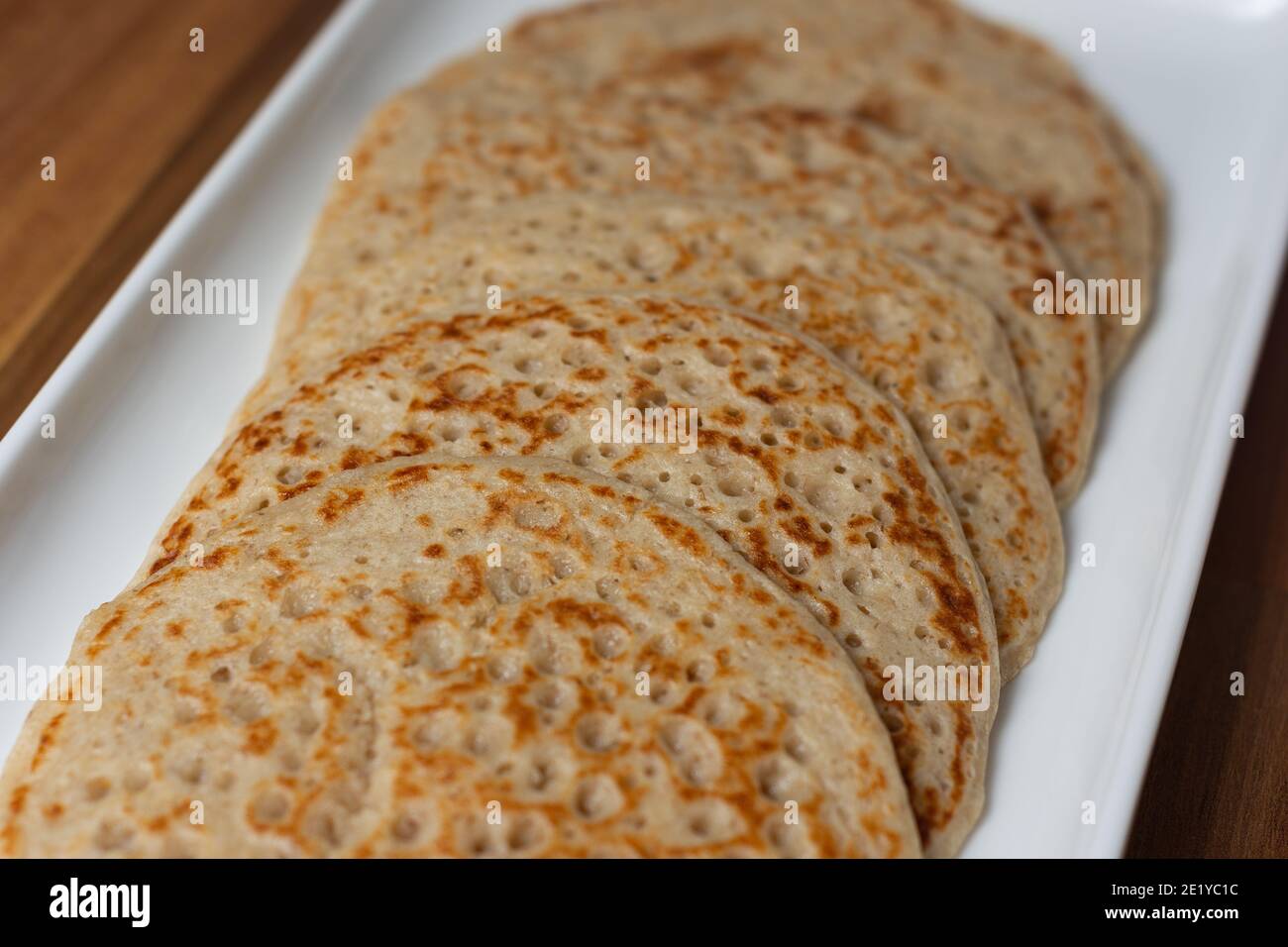 A close up of Derbyshire oatcakes on a white platter Stock Photo