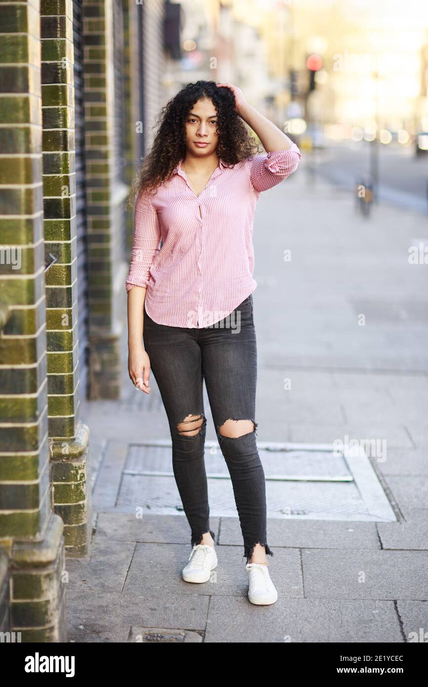 portrait of a young woman in the street Stock Photo - Alamy