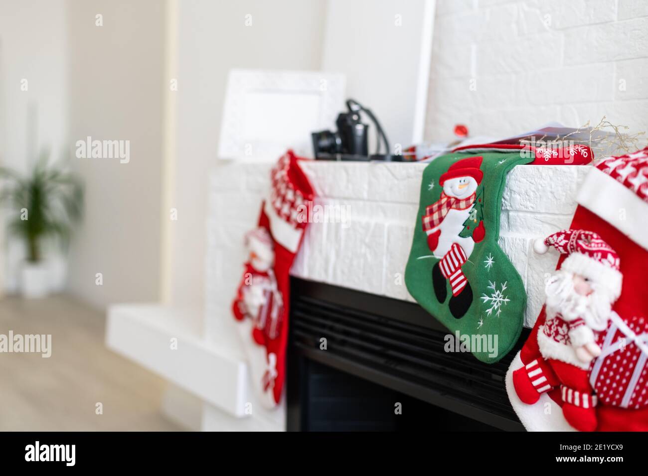 Christmas stockings on a fireplace mantel Stock Photo Alamy