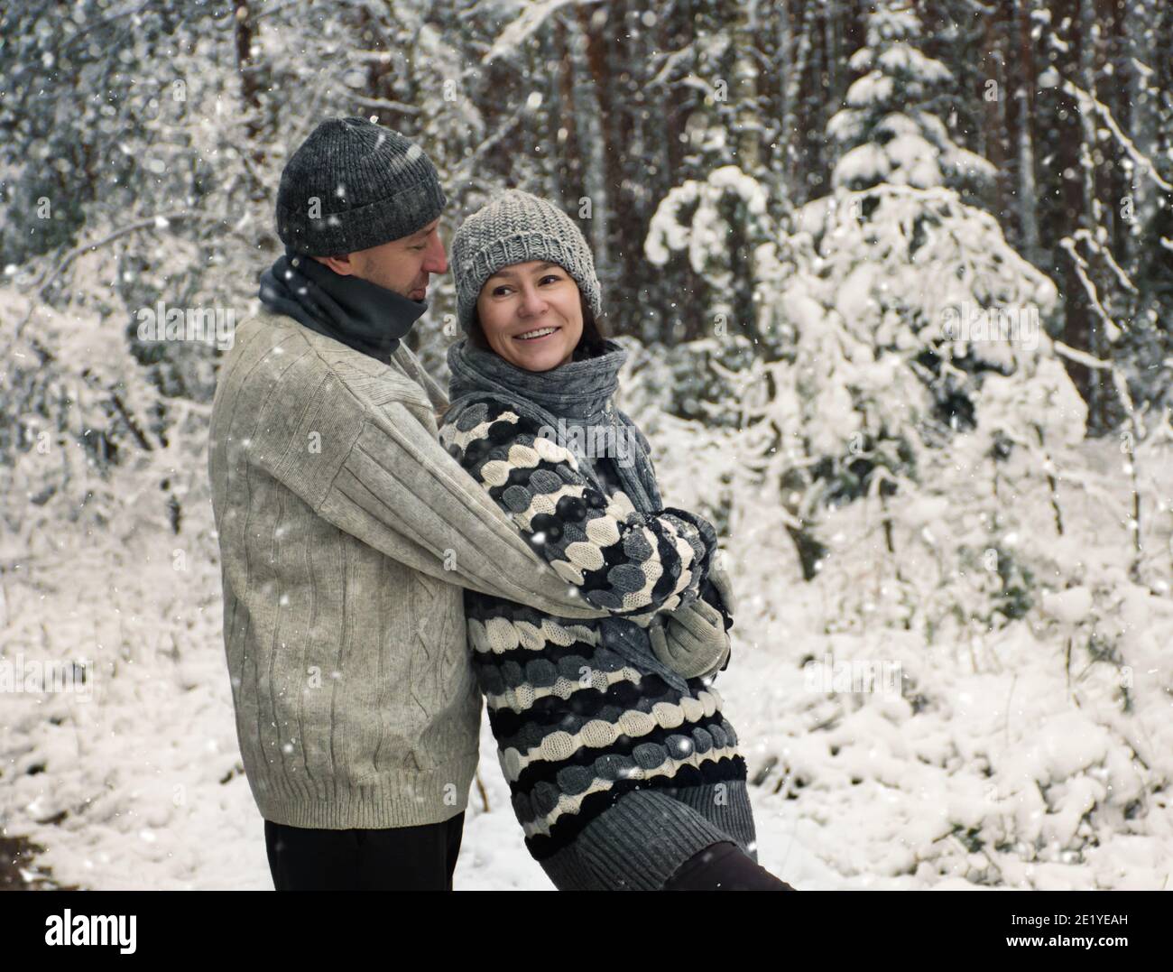 Couple hugs in winter forest hi-res stock photography and images - Alamy
