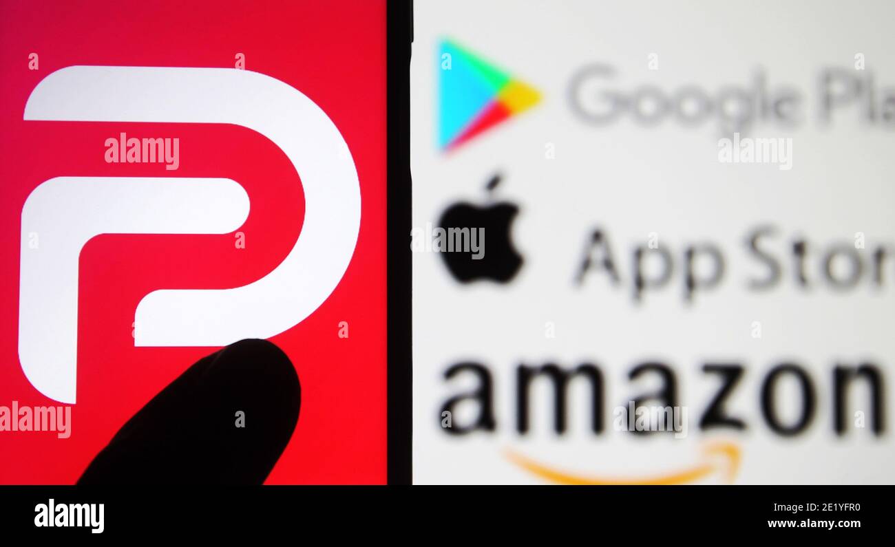 In This Photo Illustration The Parler Logo Seen Displayed On A Smartphone With The Google Play Amazon And Apple Logos Displayed On Pc Screen In The Background Google Apple And Amazon Have Suspended In This Photo Illustration The Parler Logo Seen Displayed On A Smartphone With The Google Play Amazon And Apple Logos Displayed On Pc Screen In The Background Google Apple And Amazon Have Suspended