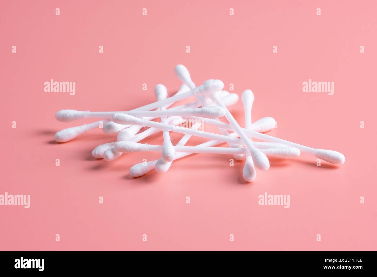 Cotton buds, ear sticks on pink background Stock Photo Alamy