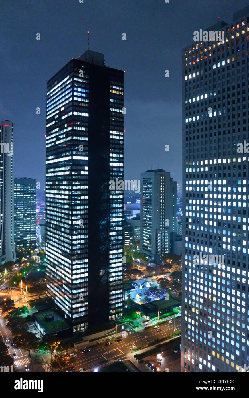 The futuristic Shinjuku-ku district at night, Tokyo JP Stock Photo