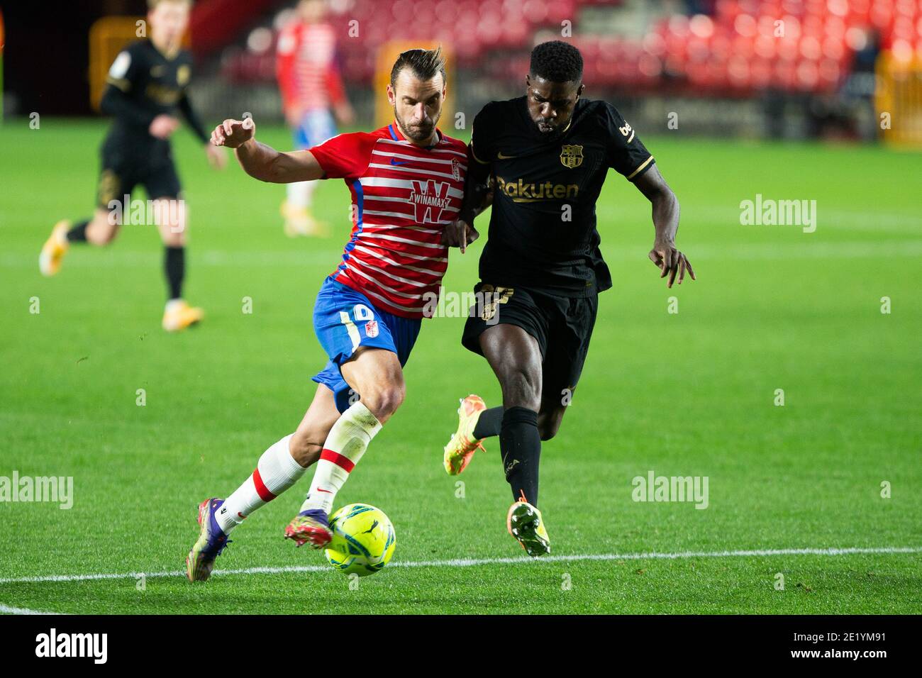 Roberto Soldado of Granada and Samuel Umtiti of Barcelona during the Spanish championship La Liga football match between Granada CF and FC Barcelona on January 9, 2021 at Nuevos Los Carmenes Stadium in Granada, Spain - Photo Joaquin Corchero / Spain DPPI / DPPI / LM Stock Photo