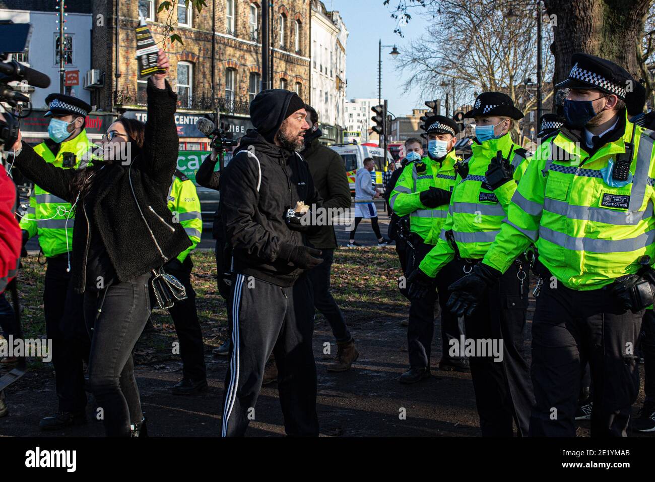 Police officers clashed with some of the maskless protesters who arrived in Clapham Common, some shouting 'take your freedom back'. Stock Photo