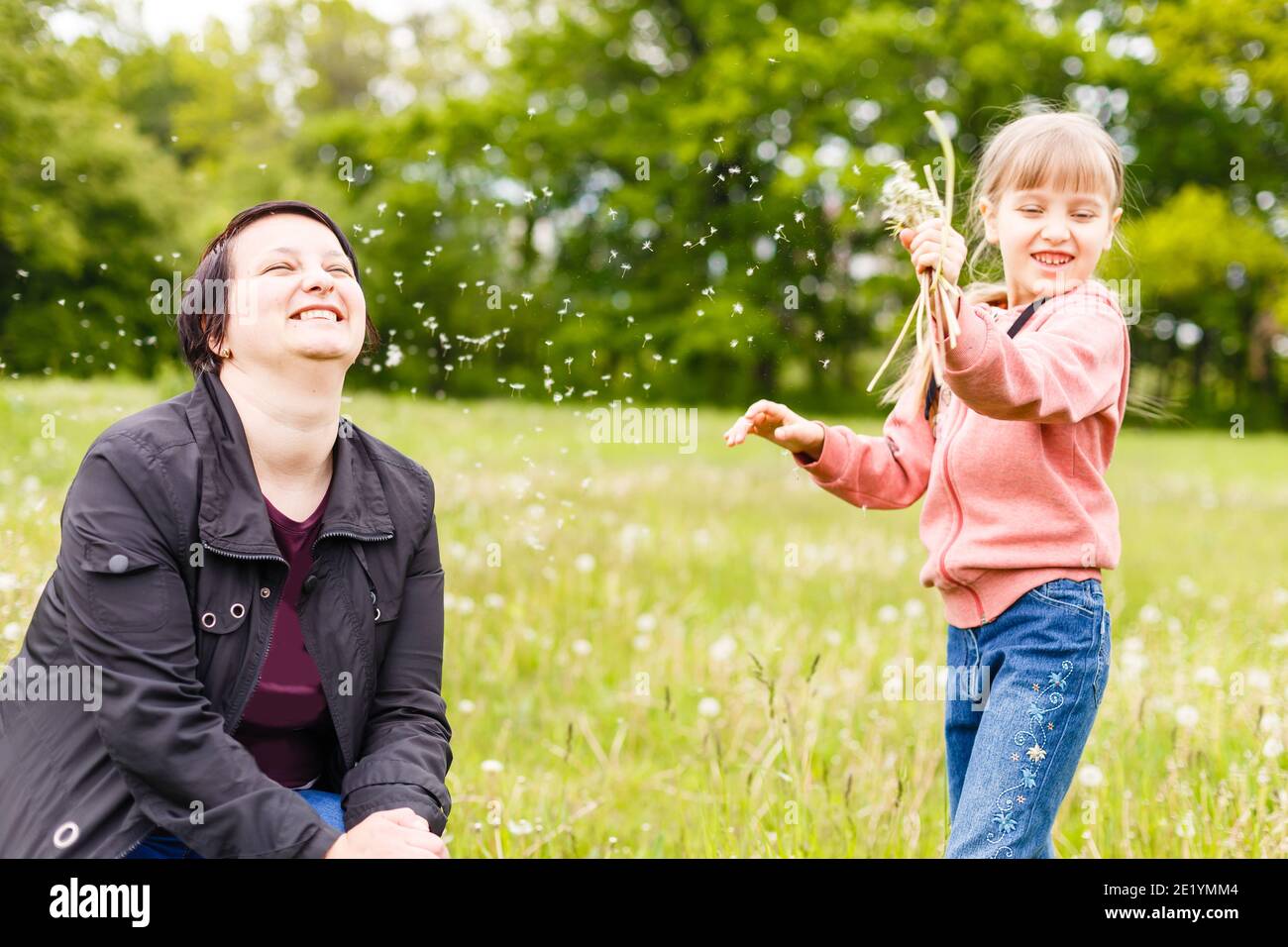 Cute little girl on the meadow in summer day Stock Photo - Alamy