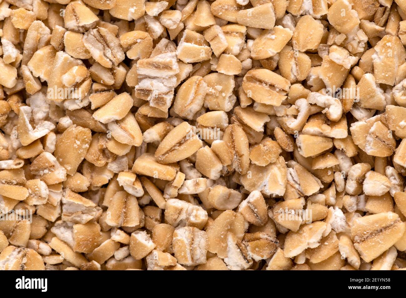 Macro of steel-cut oats, or Irish oats, background and texture. Stock Photo