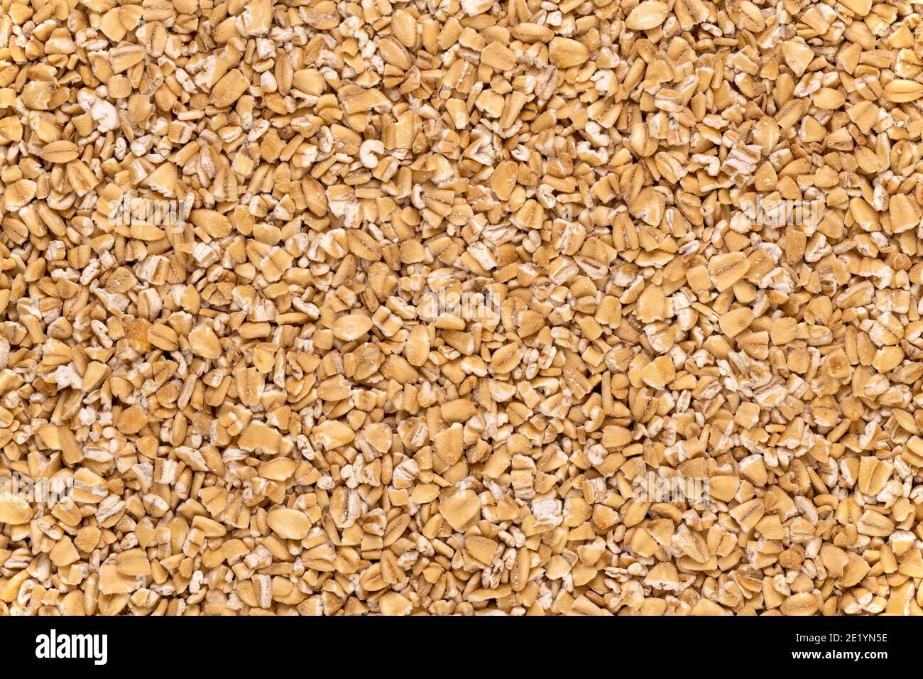 Macro of steel-cut oats, or Irish oats, background and texture. Stock Photo