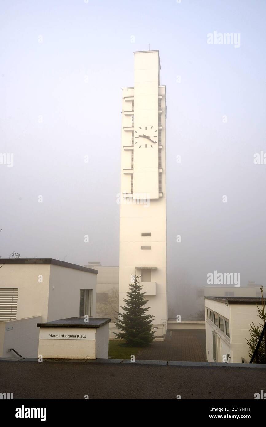 Parish of Saint Brother Klaus in Urdorf, Roman Catholic Church in vertical view, in winter at sunrise. Modern style architecture in white color. Stock Photo
