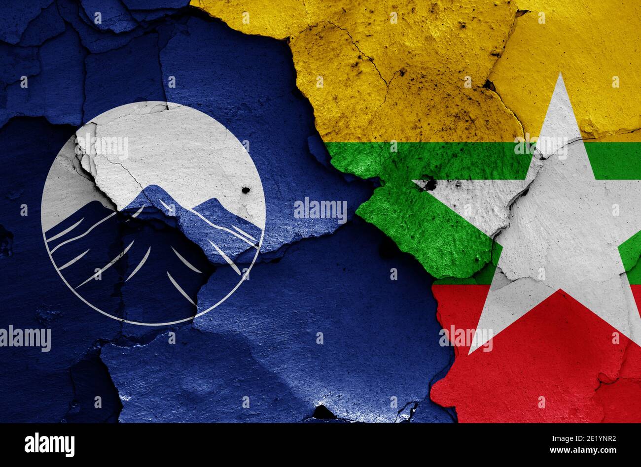 flags of Kachin State and Myanmar painted on cracked wall Stock Photo