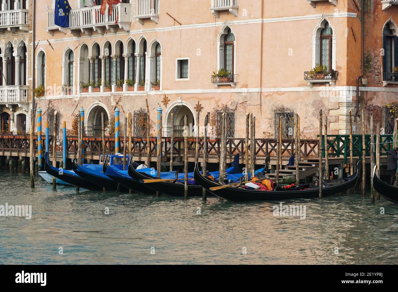 Traditional Venetian gondolas moored on Grand Canal in Venice, Italy Stock Photo