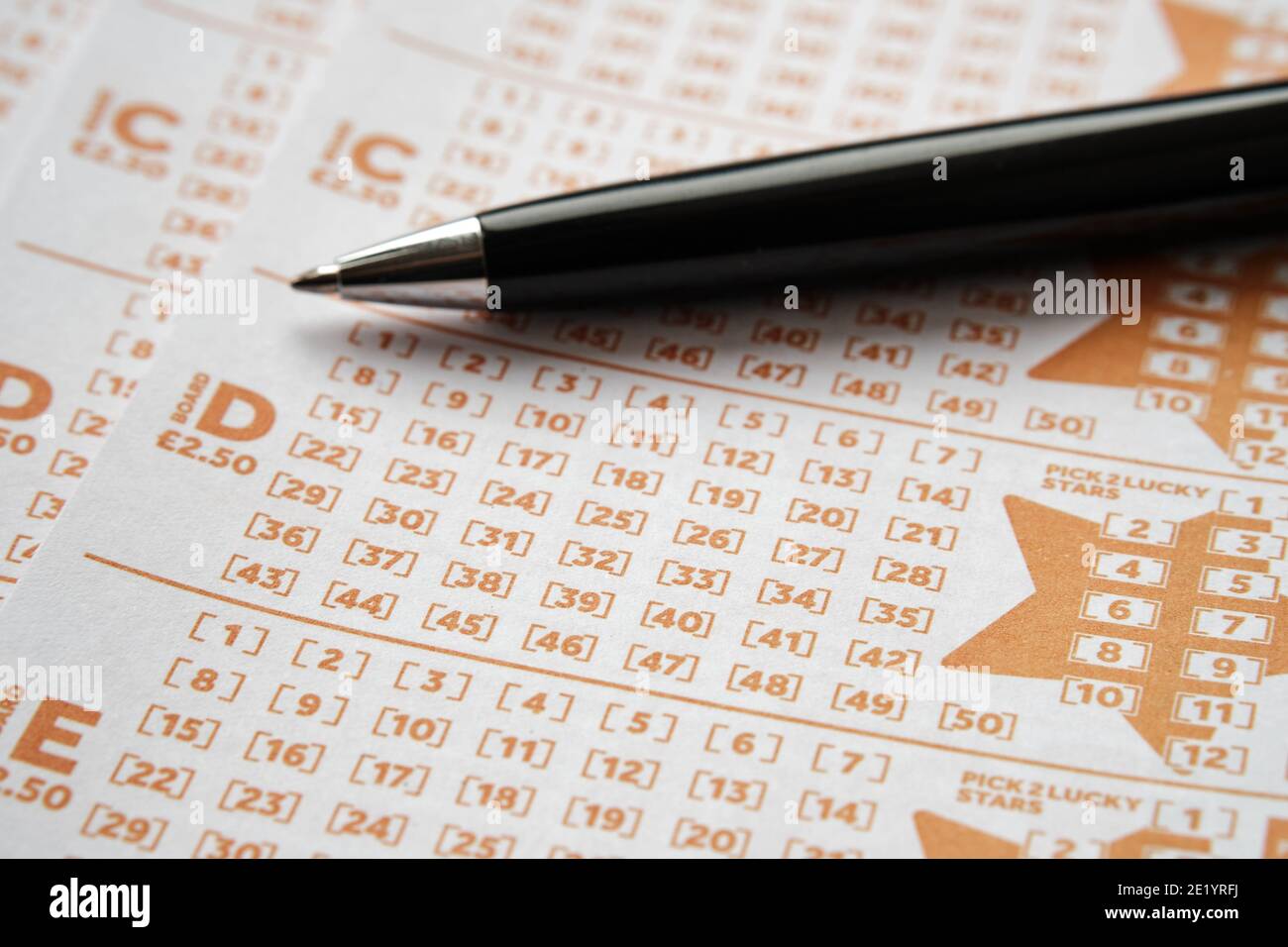Stafford, United Kingdom - November 10 2020: EuroMillions lottery cards and pen. EuroMillions is Europe's biggest lottery. Concept. Stock Photo
