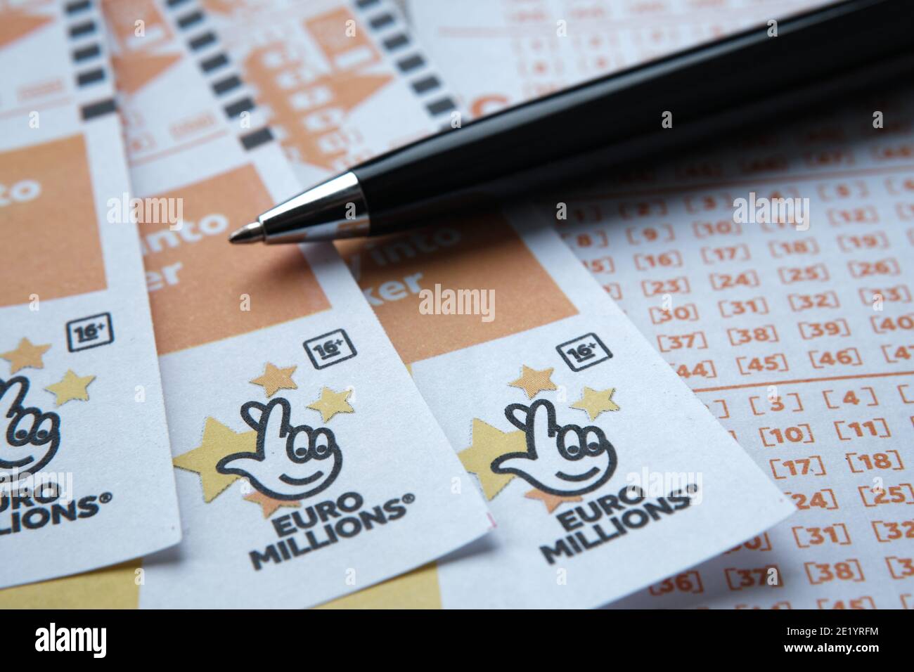 Stafford, United Kingdom - November 10 2020: EuroMillions lottery cards and pen. EuroMillions is Europe's biggest lottery. Concept. Stock Photo