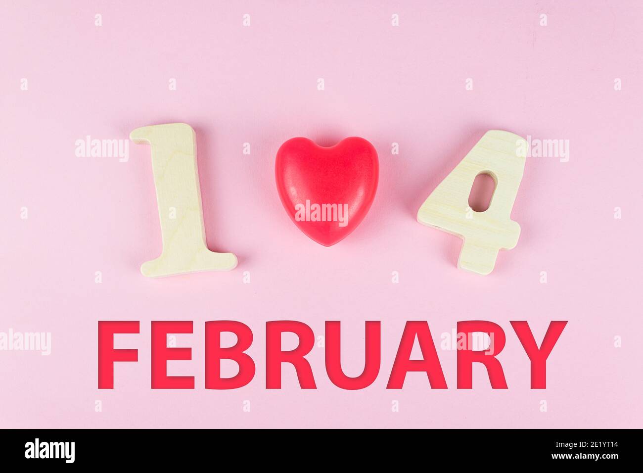 Happy Valentines Day Concept. Close-Up Of Wooden Number 14 and text FEBRUARY. Top view. Flat lay Stock Photo