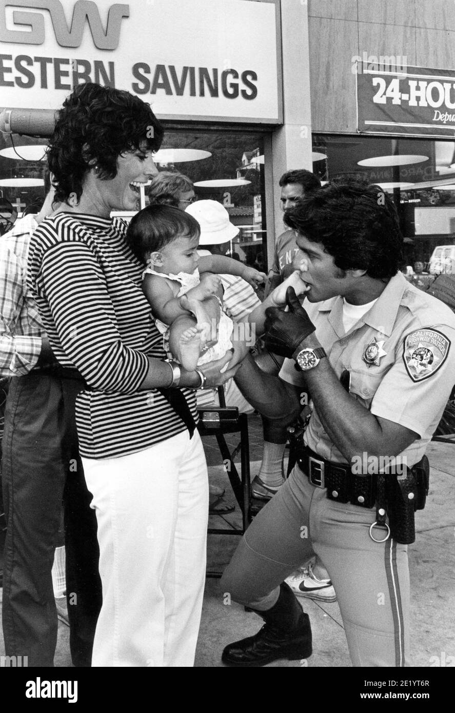 ERIK ESTRADA WITH BEVERLY ADAMS SASSOON AND HIS 7 MONTHS OLD NIECE ELLIE BETWEEN TAKES ON THE ' CHIPS ' SET Credit: Ralph Dominguez/MediaPunch Stock Photo