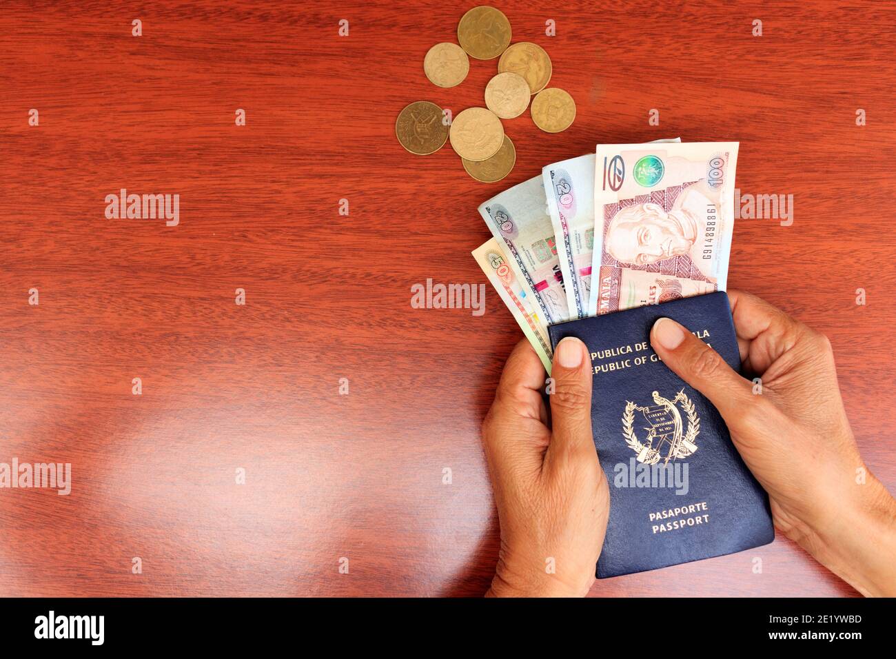 hands holding passport and money Stock Photo
