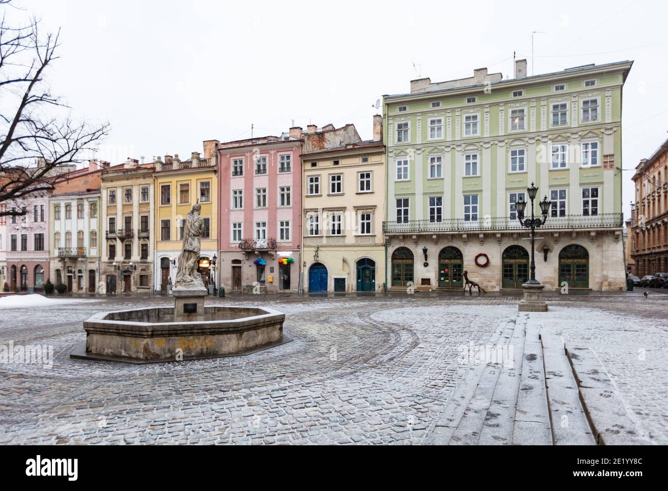 Lviv, Ukraine - January 10, 2021: Empty Lviv streets during COVID-19 Quarantine. Adonis fountain in Lviv Stock Photo