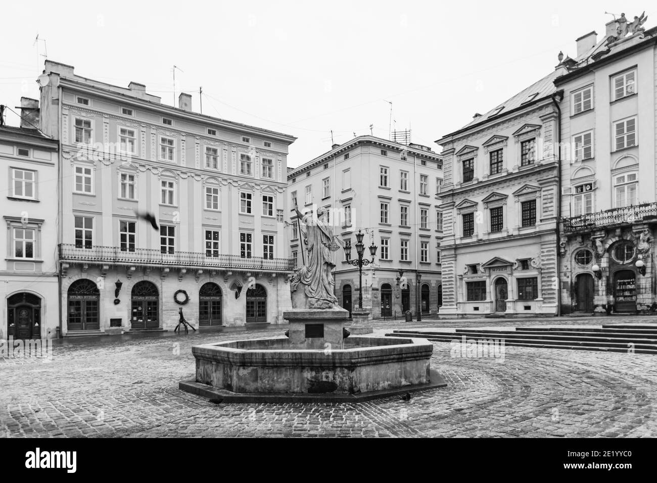 Lviv, Ukraine - January 10, 2021: Empty Lviv streets during COVID-19 Quarantine. Adonis fountain in Lviv Stock Photo