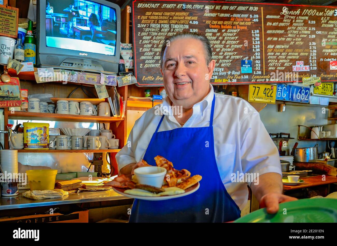 Abe Whitfield serves breakfast at his diner, Abe's Grill, March 5, 2012, in Corinth, Mississippi. Stock Photo