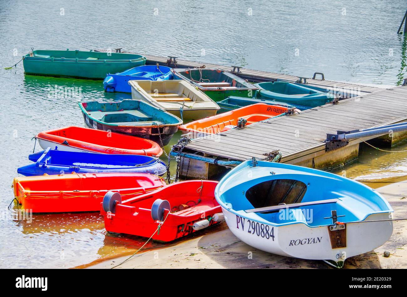Coloured rowing boats at jetties. Copy Space for characters or letters
