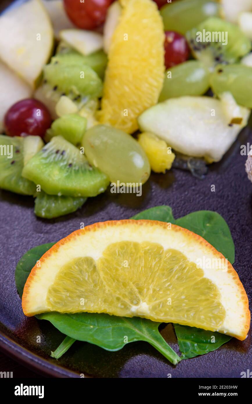 Fruit salad with tropical fruits, 45 degree angle, close-up Stock Photo