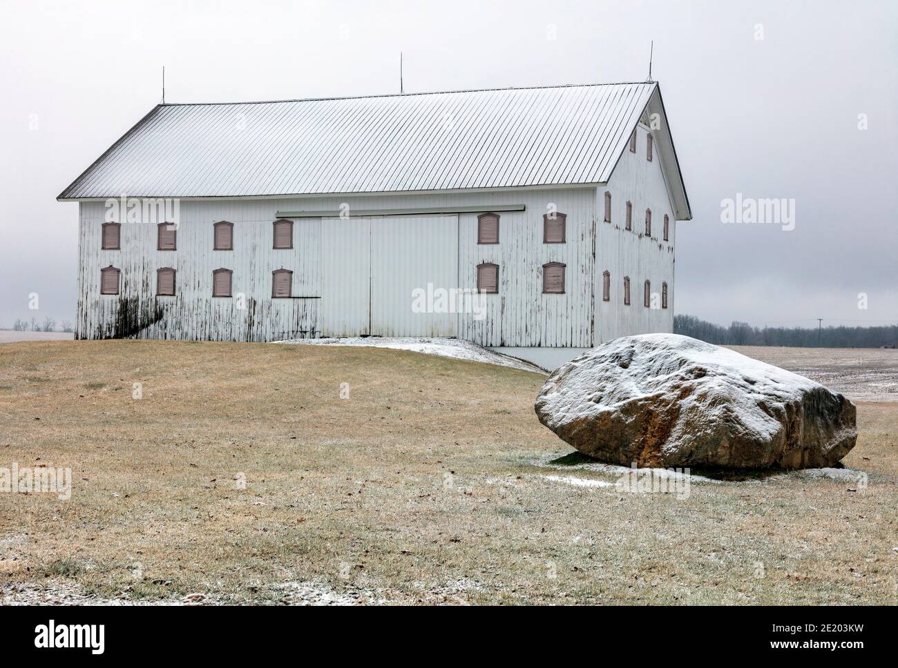 Barn, with boulder in foreground, glacial erratic, Michigan, USA, by James D Coppinger/Dembinsky Photo Assoc Stock Photo