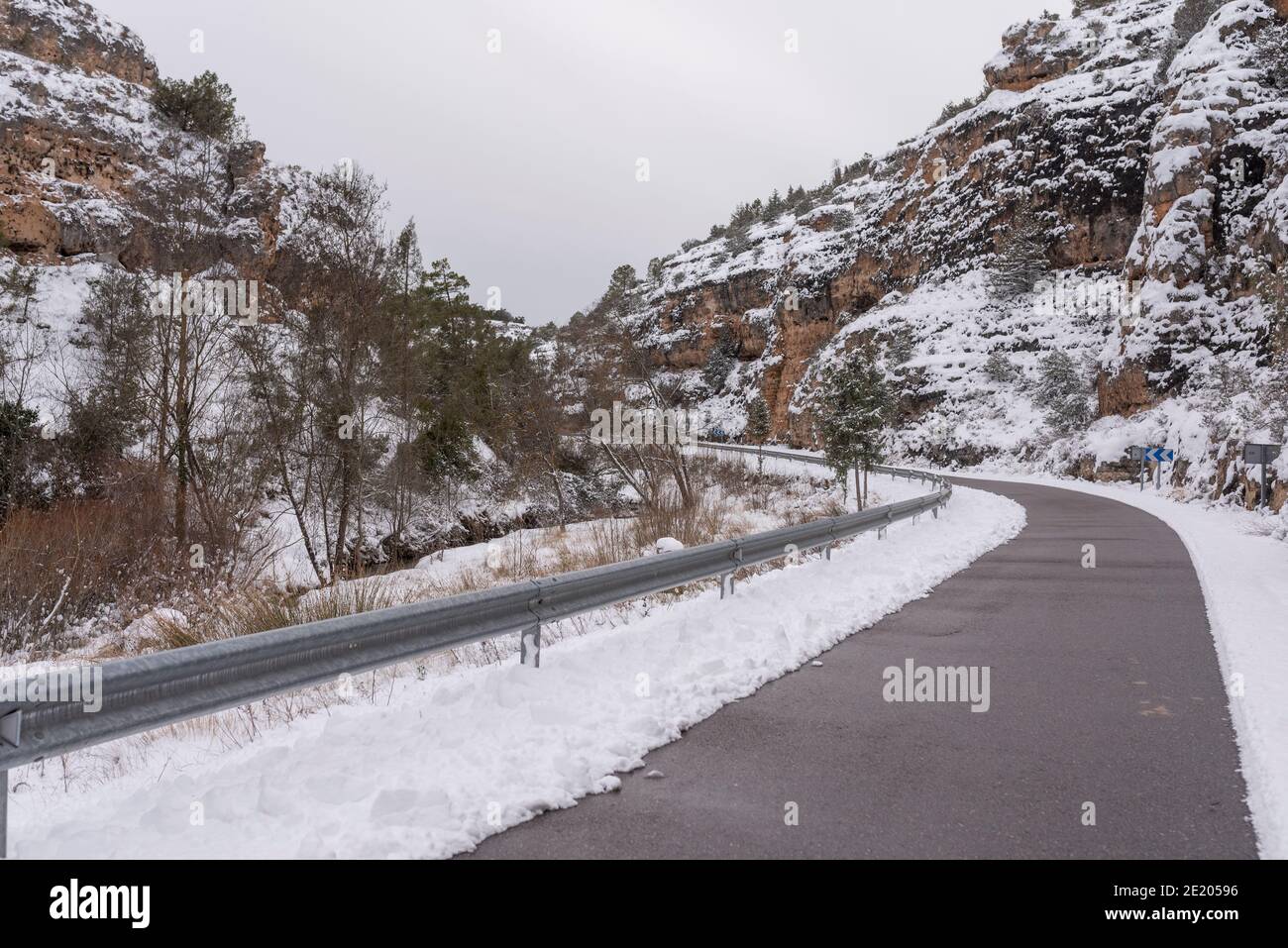 snowy landscape with road without snow Stock Photo
