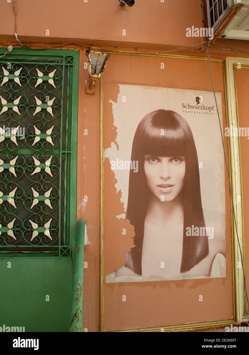 Old Schwarzkopf advertising at hairdressers in in Nymfes, Corfu, Greece Stock Photo