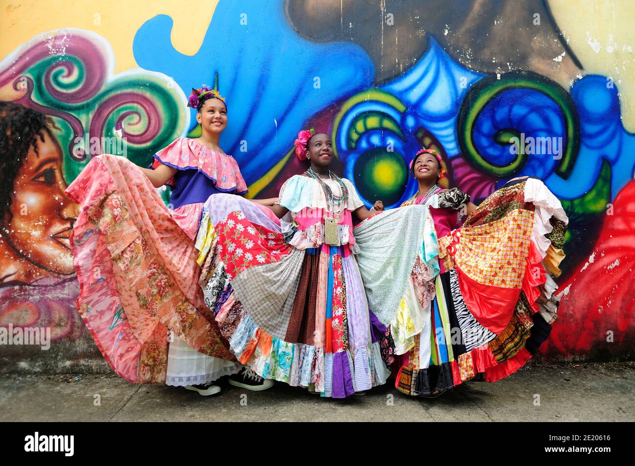 Panamanian girls wearing the pollera conga, a panamanian typical costume, at Portobelo, Panama, during Congos and Diablos Festival. Stock Photo
