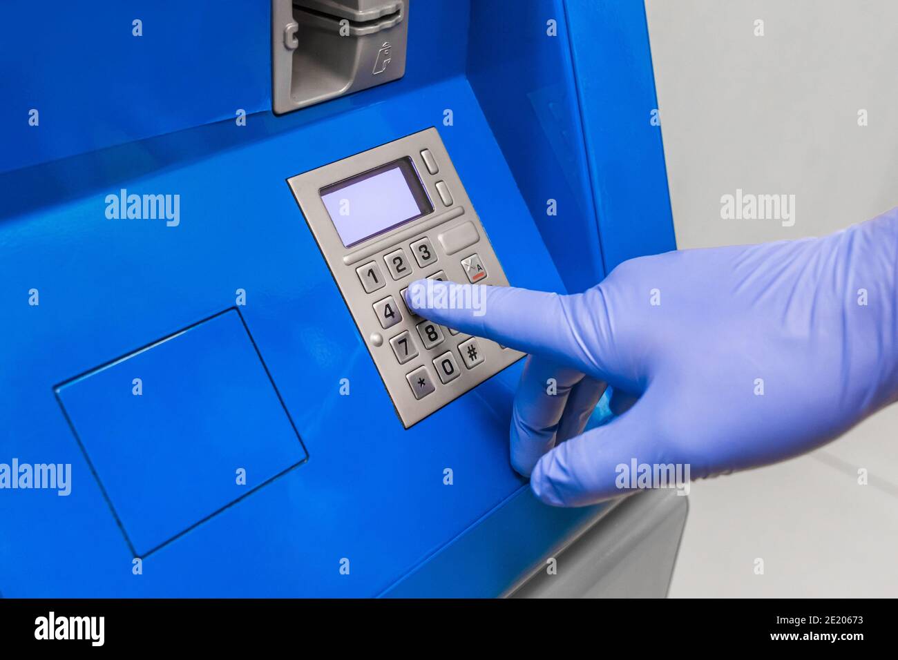 Hand in gloves enter pin hi-res stock photography and images - Alamy