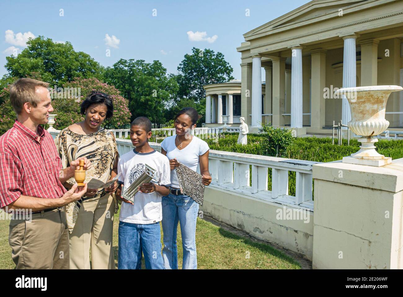 Alabama Demopolis Gaineswood Greek Revival mansion 1861,guide man Black family parent children mother son daughter,boy girl teen teenage teenager expl Stock Photo