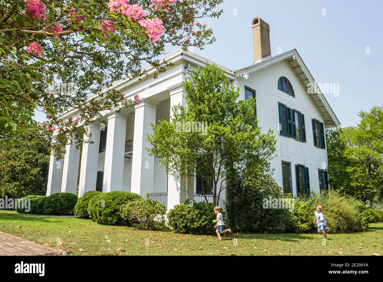 Alabama Demopolis Bluff Hall Federal Greek Revival style 1832 1850,crepe myrtle outside exterior,historic home Stock Photo
