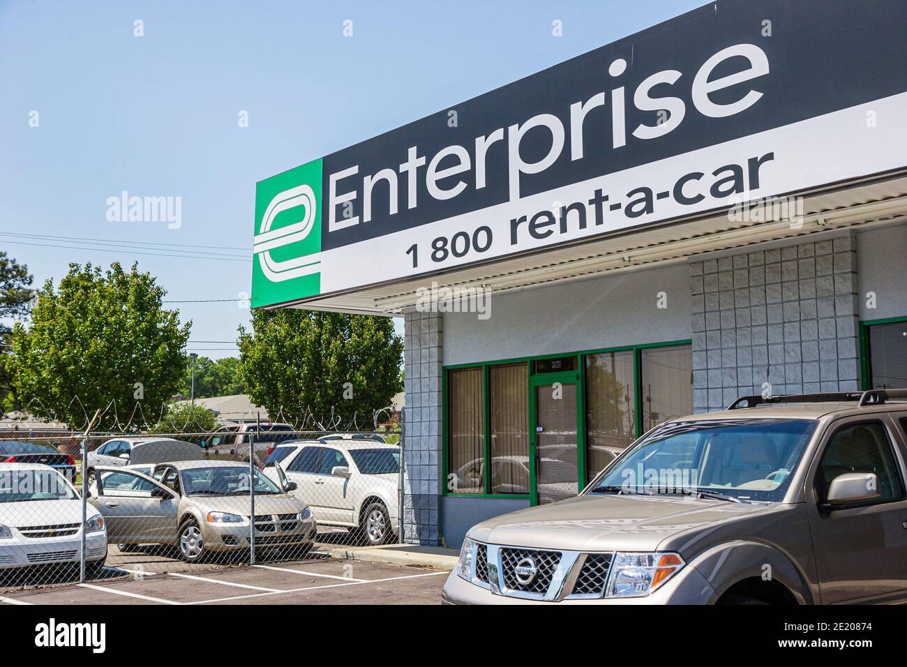 Alabama Montgomery Enterprise Rent a car,sign logo toll free telephone phone number,lot cars vehicles business outside exterior front entrance, Stock Photo