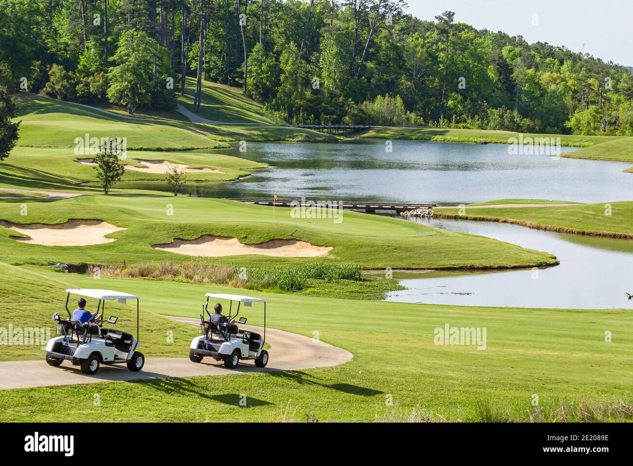 Alabama Greenville Cambrian Ridge Golf Course,Robert Trent Jones Golf Trail,golfer players electric carts lake water, Stock Photo
