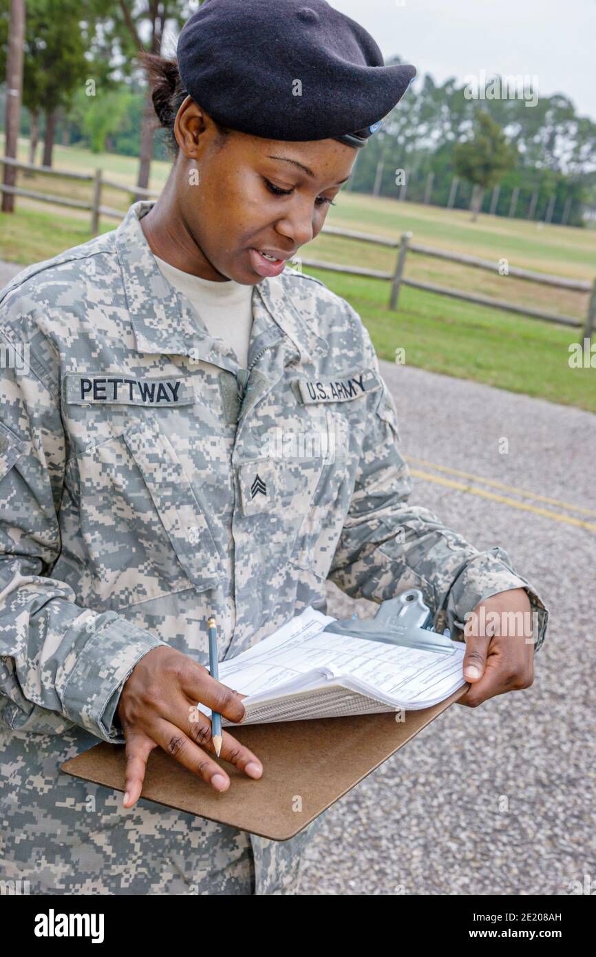 Alabama Mobile Brookley Center centre Army National Guard,Physical Training Program woman female member clipboard uniform supervising Stock Photo