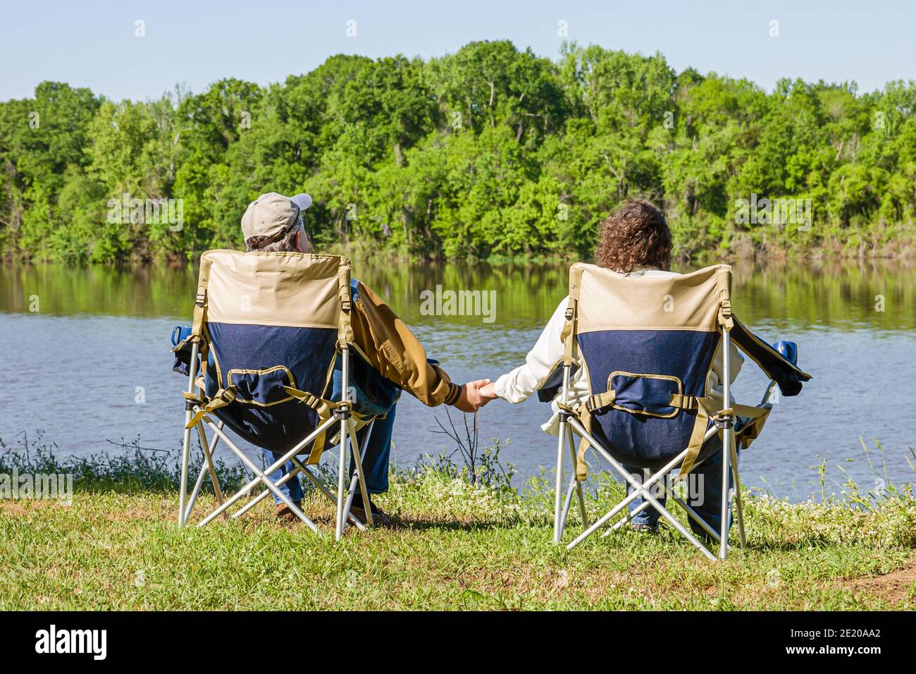 Alabama Monroeville Isaac Creek Campground,Claiborne Lake Alabama River Lakes water scenery,man woman female couple relaxing holding hands, Stock Photo