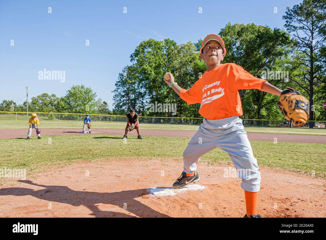 Alabama Monroeville Veterans Park little league baseball,Black boy male pitcher ball glove players field practice, Stock Photo