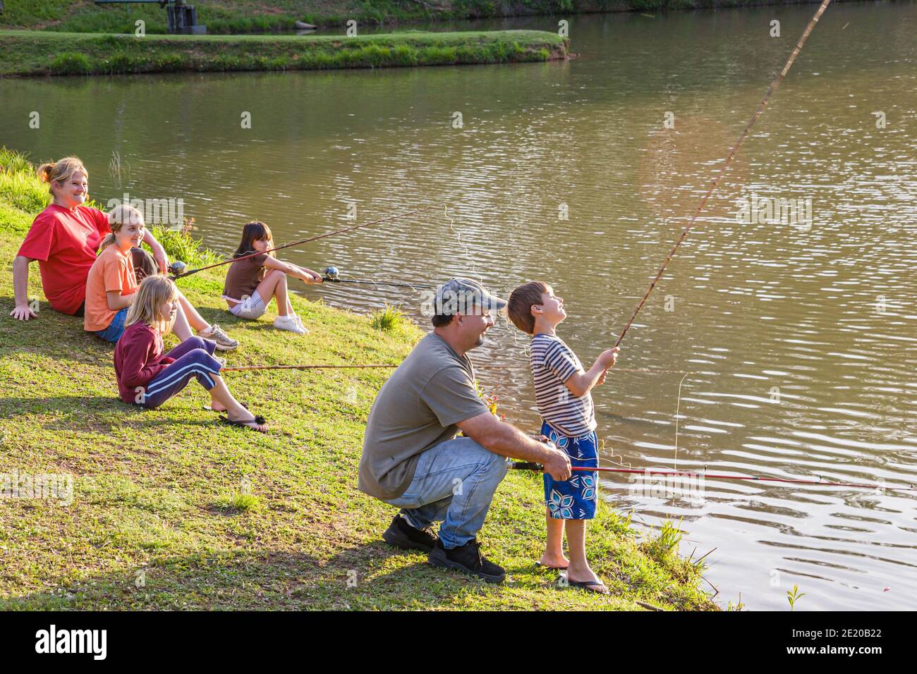 Alabama Monroeville Park Drive Vanity Fair Lake,family parents children fishing father mother boy girls, Stock Photo