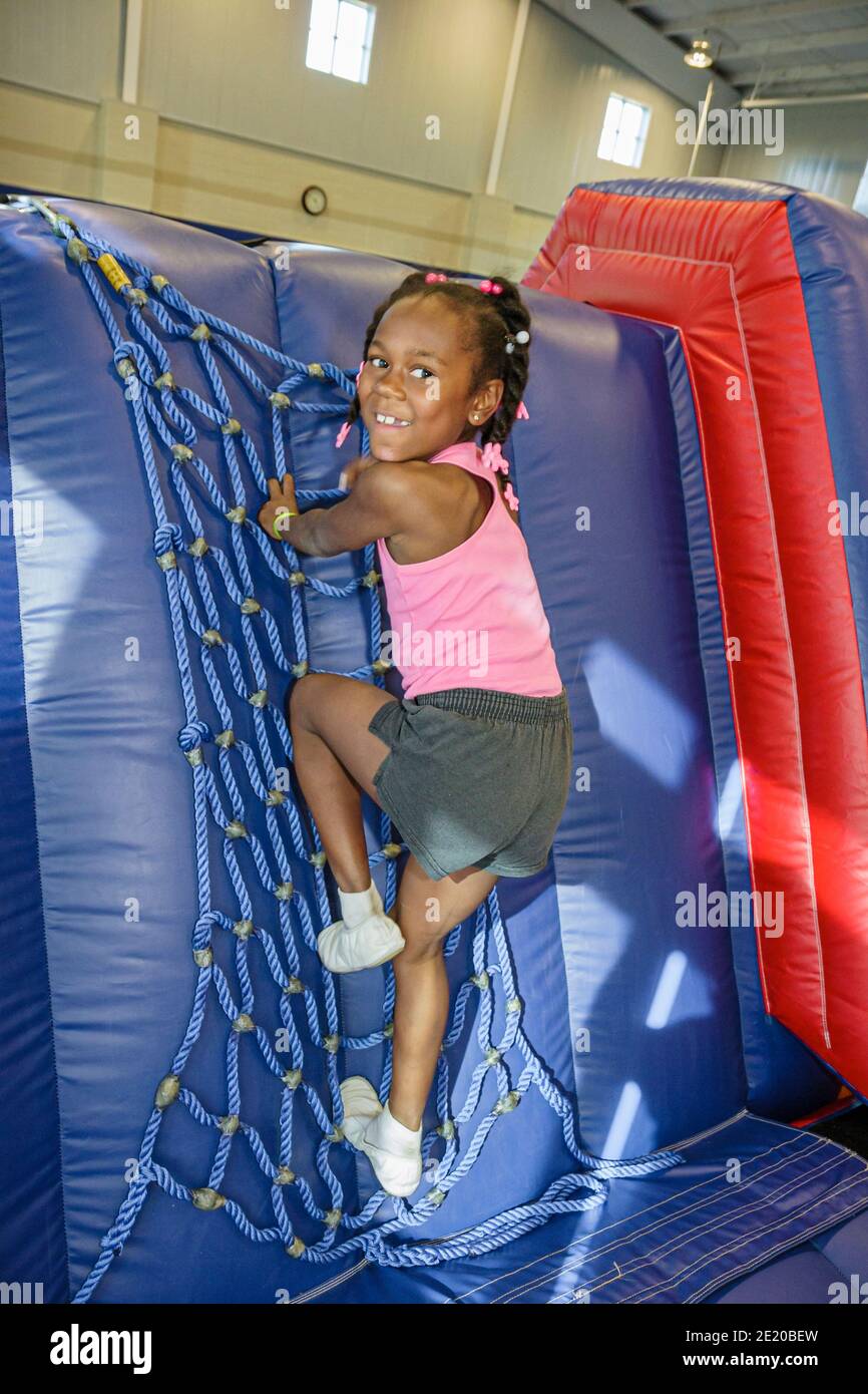 Alabama Troy Community Recreation Center centre Sportsplex,gymnastics class Black girl climbing, Stock Photo