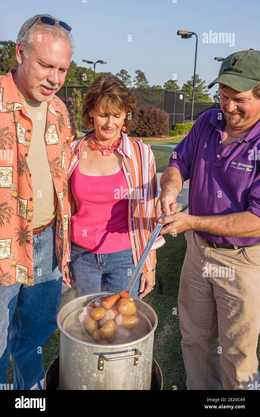 Alabama Dothan Westgate Tennis Center centre Movie Gallery Pro Classic,steaming steamed potatoes sausage man woman female couple, Stock Photo