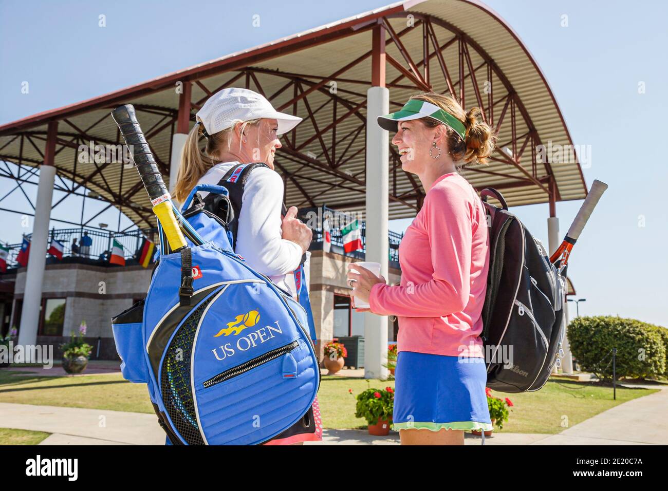 Alabama Dothan Westgate Tennis Center centre Movie Gallery Pro Classic,woman female pro player carrying equipment bag volunteer talking, Stock Photo