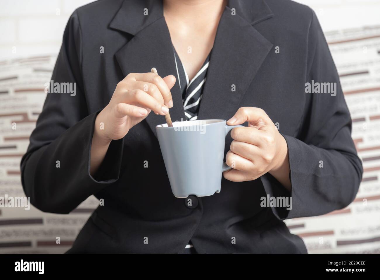 Young woman stir tea in cup Stock Photo by ©chaoss 5439328