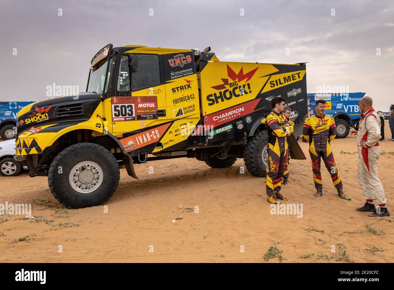 Horimlaa, Saudi Arabia - January 7, 2021: The crew of Team Big Shock Racing near their truck Iveco before the start of Stage 5 of Dakar Rally Stock Photo