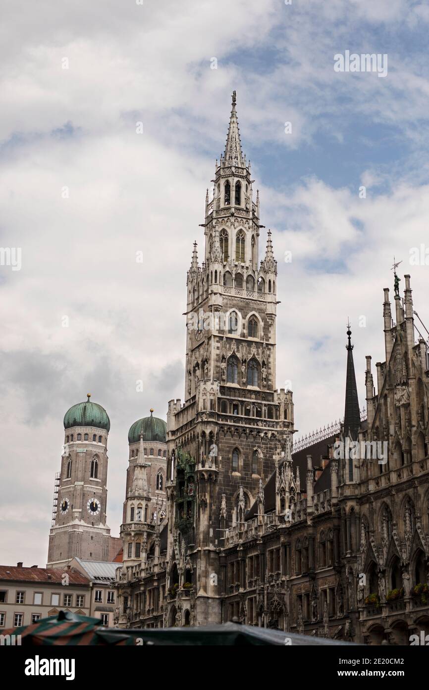 The Neues Rathaus (new town hall) on Marienplatz in Munich, Germany. The two domes of the Frauenkirche are visible behind it. Stock Photo