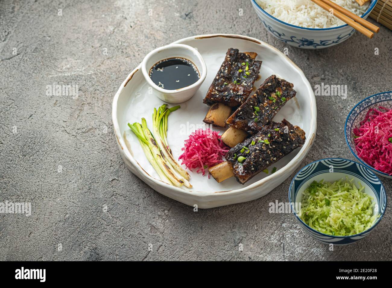 Tender Beef short ribs with radish and rice, copy space Stock Photo - Alamy