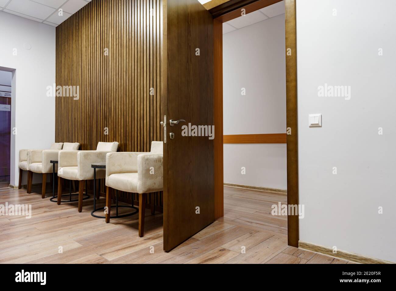 Office waiting area with arm chairs and coffee table Stock Photo Alamy